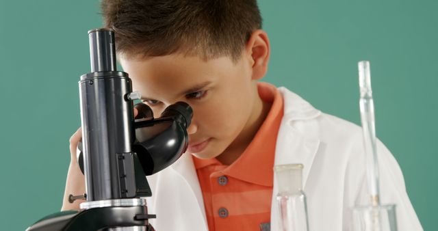 Young Boy Looking Through Microscope in Science Class - Download Free Stock Images Pikwizard.com