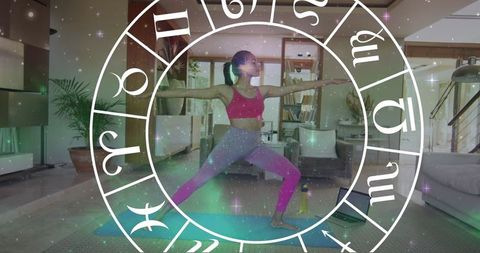 Zodiac Signs Overlay on Woman Practicing Yoga in Home Space - Download Free Stock Images Pikwizard.com