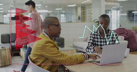 Diverse Professionals Analyzing Data Trends in Modern Office