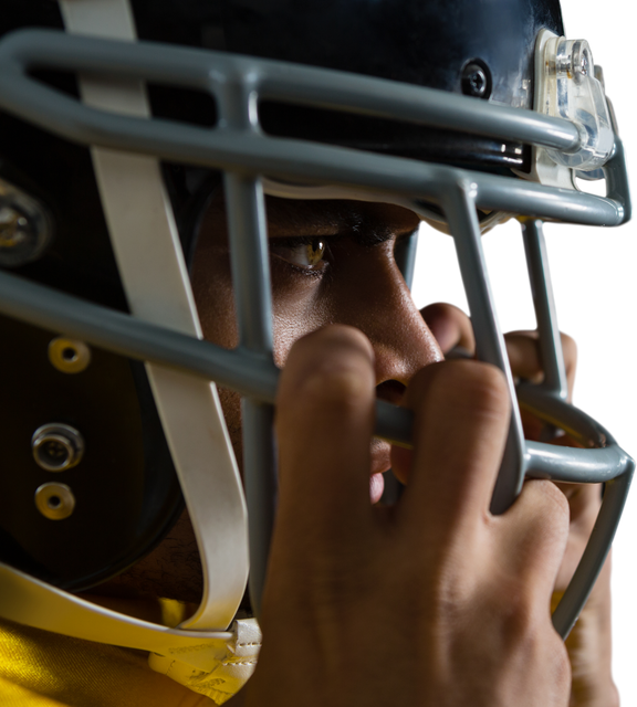 Close-up of confident American football player adjusting helmet, looking forward - Download Free Stock Videos Pikwizard.com