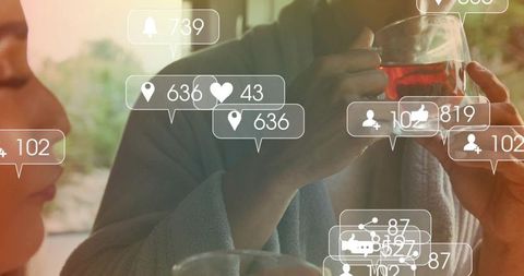 Couple enjoying morning tea with social media notifications overlay, digital lifestyle