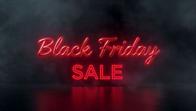 Glowing Red Neon Black Friday SALE Sign on Reflective Floor with Foggy Atmosphere