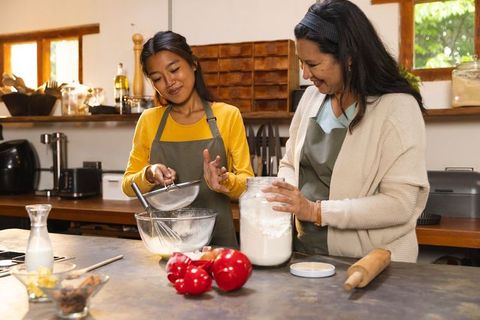 Daughter and Mother Baking in Cozy Kitchen Home Baking Scene