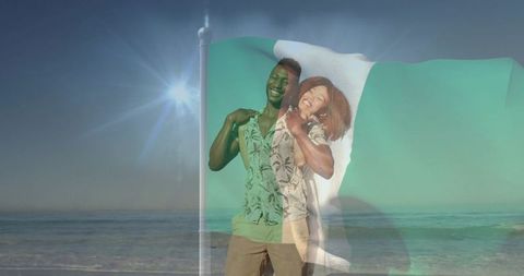 Smiling black couple embracing on beach waving nigerian flag double exposure romance
