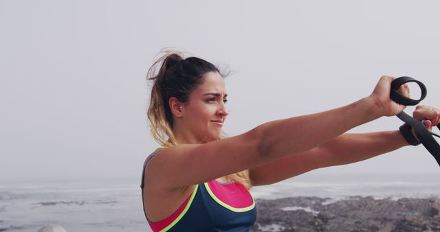 Fit Woman Exercising with Suspension Bands by Sea - Download Free Stock Images Pikwizard.com