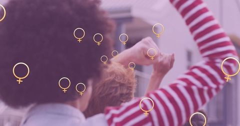 women's empowerment concept with raised fists and gender symbols - Download Free Stock Images Pikwizard.com
