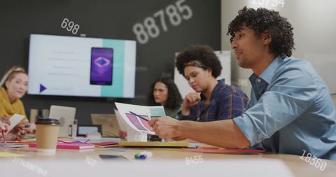 Diverse Team Collaborating in Modern Office with Data Overlays