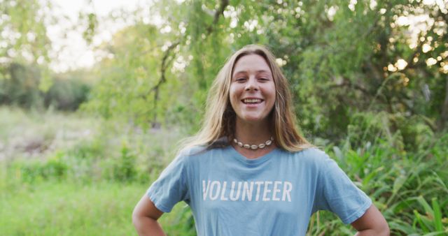 Smiling Young Volunteer in Nature Setting - Download Free Stock Images Pikwizard.com