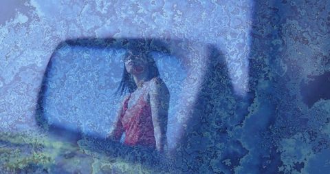 Reflective scene with woman on nautical vessel