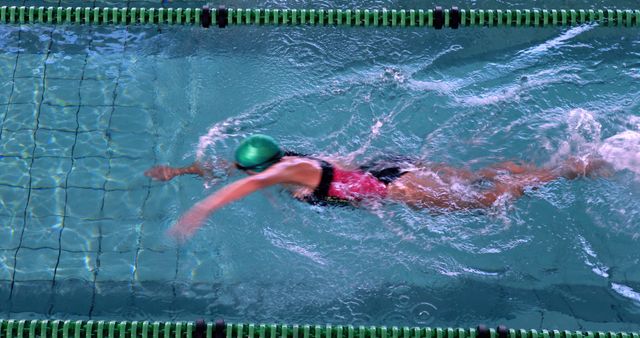 Professional Female Swimmer Practicing in Pool - Download Free Stock Images Pikwizard.com