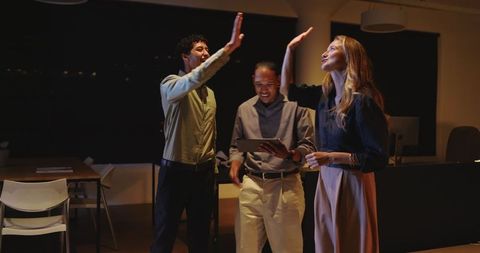 Diverse Professionals Celebrating Success with High Five