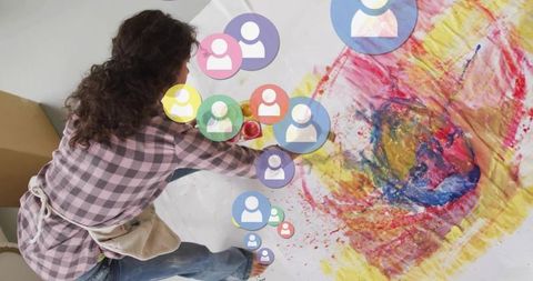 Abstract Artist Creating Vibrant Mixed Media Painting in Studio