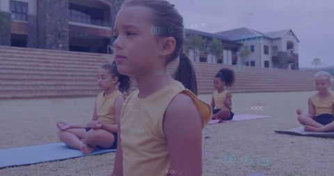 Young girls practicing outdoor meditation and mindfulness