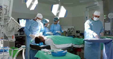 Diverse Surgical Team Performing Procedure in Modern Operating Room