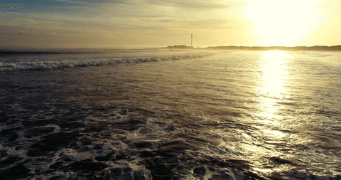 breathtaking transparent ocean waves at sunset with scenic horizon - Download Free Stock Videos Pikwizard.com
