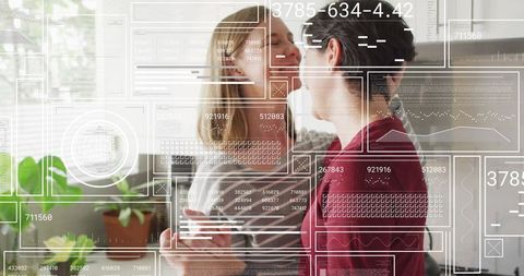 Modern romantic connection: women share affection in digitally enhanced kitchen