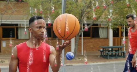 Black athlete balancing basketball under digital transformation