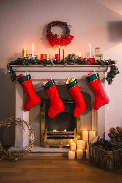 Festive fireplace adorned with red stockings, candles, and holiday decorations. Ideal for promoting Christmas home decor, holiday greeting cards, and seasonal advertisements. Perfect for illustrating cozy holiday scenes and traditional Christmas celebrations.