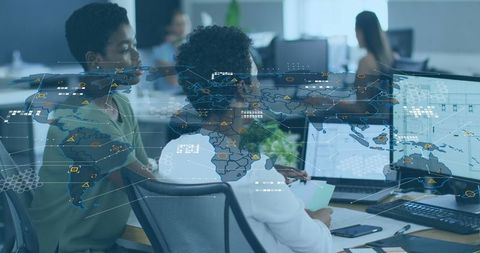 Diverse Business Women Analyzing Global Data in Modern Office
