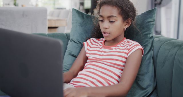 Young Girl Relaxing with Laptop on Couch in Cozy Living Room - Download Free Stock Images Pikwizard.com