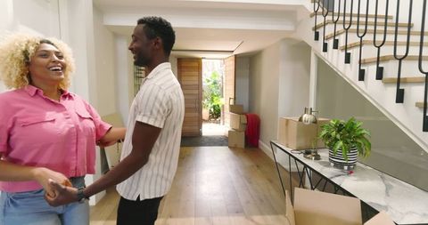 Joyful couple moving into new home embracing peaceful living