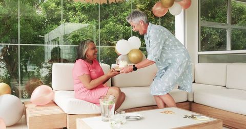 Senior Lesbian Couple Celebrating Birthday with Joyful Love