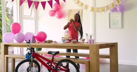 Birthday Celebration with Father and Daughter in Festive Room Decor