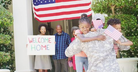 Joyful Homecoming of Military Father with Embracing Family - Download Free Stock Images Pikwizard.com
