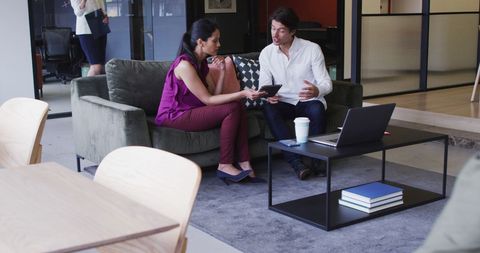 Diverse Business Team Collaborating in Modern Office Lounge