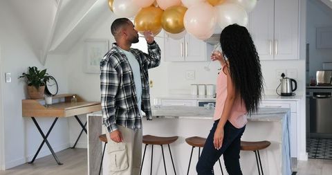 Couple Celebrating Anniversary in Modern Kitchen