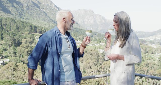 Happy Senior Couple Enjoying Wine with Mountain View - Download Free Stock Images Pikwizard.com