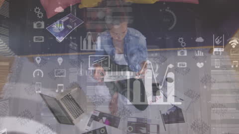 Businesswoman Analyzing Data on Laptop with Virtual Overlay