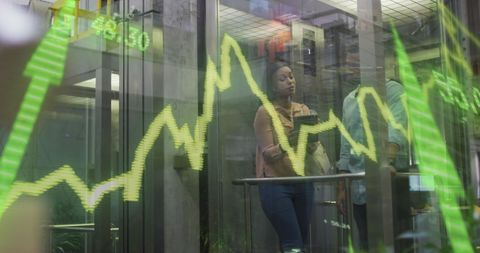 Business Professionals with Overlay of Financial Data Graphs