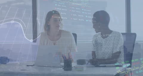 Diverse Colleagues Discussing Financial Data with Digital Overlay