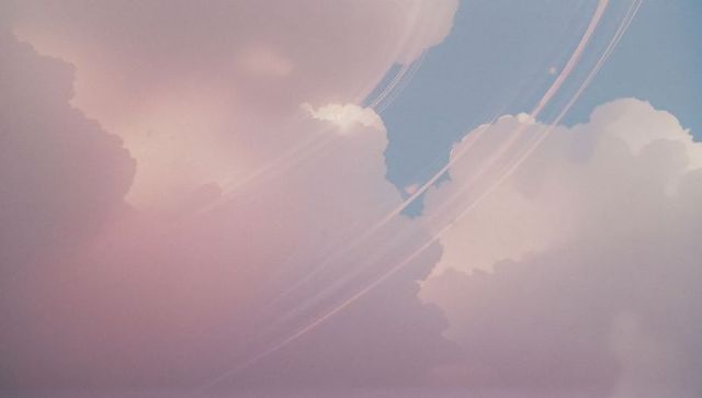 Dreamy pastel clouds with celestial ring arcs