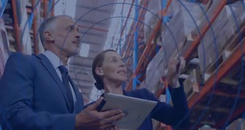 Warehouse Colleagues Using Tablet to Manage Stock Inventory