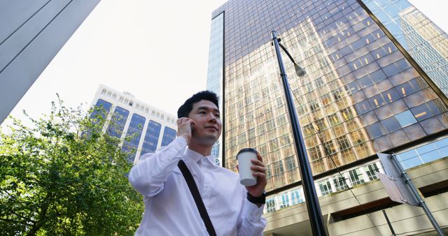 Man with Coffee Walking in City Business District - Download Free Stock Images Pikwizard.com