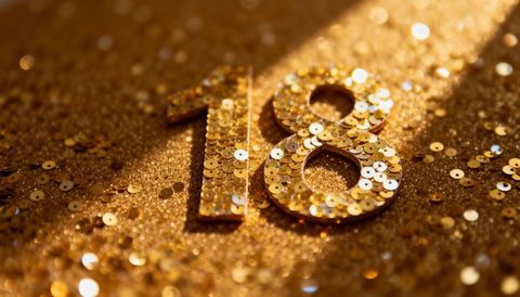 Gold sequin 18 numeral glittering closeup for birthday anniversary new year celebration