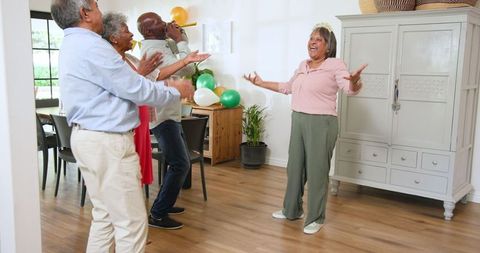 Joyful Seniors Celebrating Birthday at Home Gathering