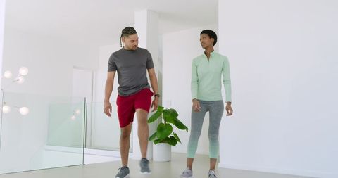 Fit Friends Exercising in Modern Minimalist Space