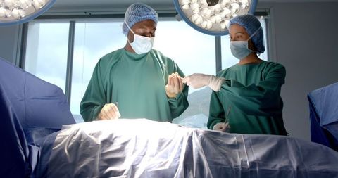 Diverse surgical team performing operation with precision and care