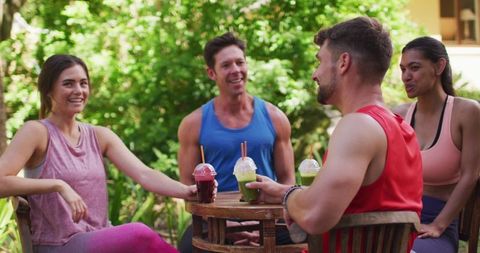 Group enjoying refreshing juices after outdoor yoga session