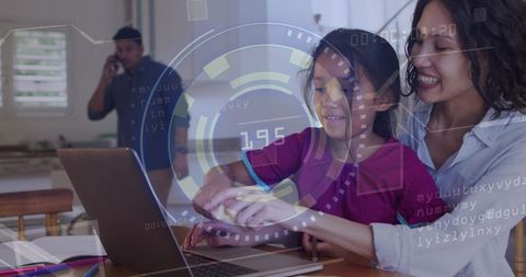 Woman guiding child using laptop with augmented reality learning overlay at kitchen table