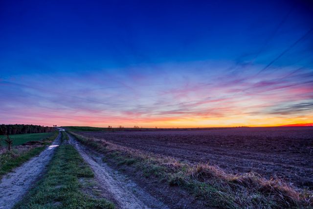 Rural Dirt Road with Vibrant Sunset Sky - Download Free Stock Photos Pikwizard.com