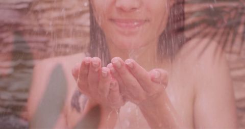 Woman Enjoying Outdoor Shower in Natural Setting