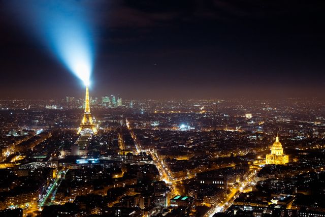 Eiffel Tower Illuminated Over Paris at Night with Dramatic Skybeam - Download Free Stock Photos Pikwizard.com