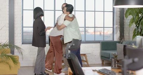 Diverse Colleagues Enjoying Casual Meeting in Modern Office