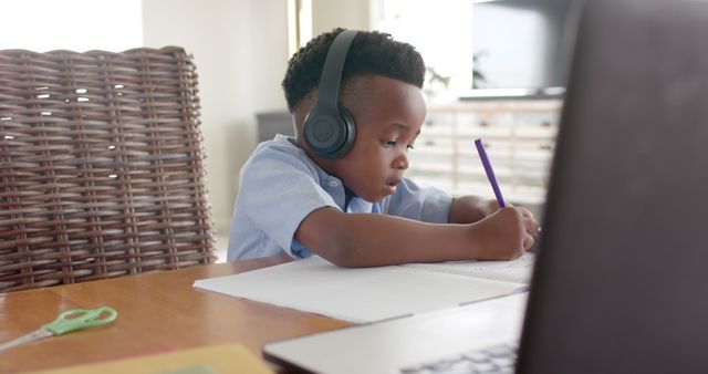 Young Boy Wearing Headphones Studying at Home - Download Free Stock Images Pikwizard.com