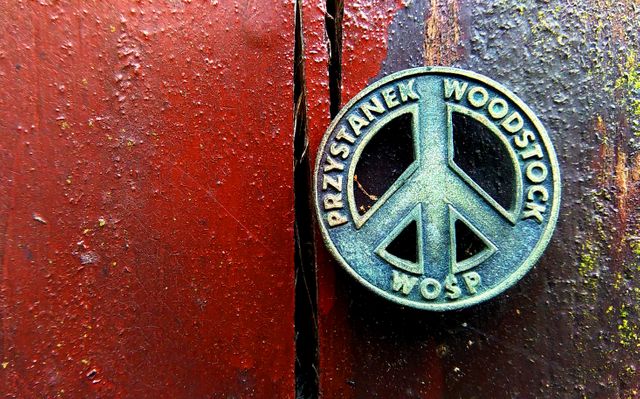 Vintage Przystanek Woodstock WOŚP Peace Symbol Pin on Rustic Wood - Download Free Stock Photos Pikwizard.com