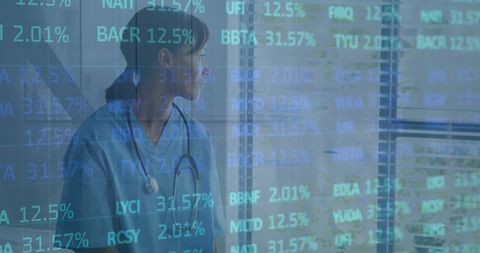 financial data overlay on female nurse looking at window - Download Free Stock Images Pikwizard.com